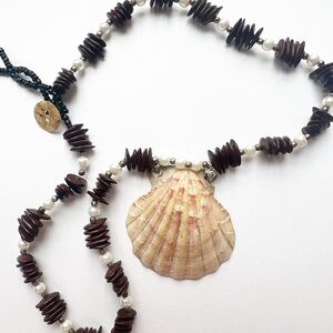 Seashell with pearls and seeds. Authentic seashell
With authentic real seeds!